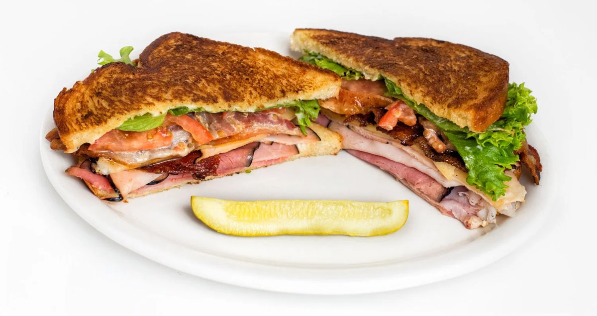 River Street Deli sandwich served with pickle